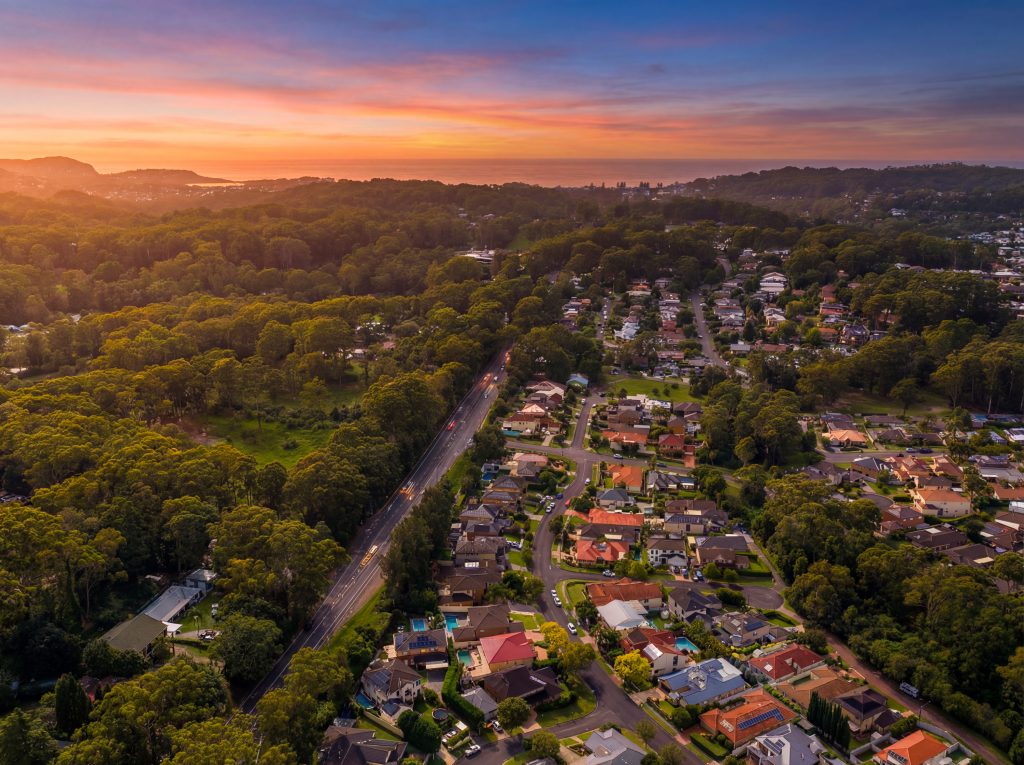 Aerial view over Erina NSW at sunset looking towards the coast