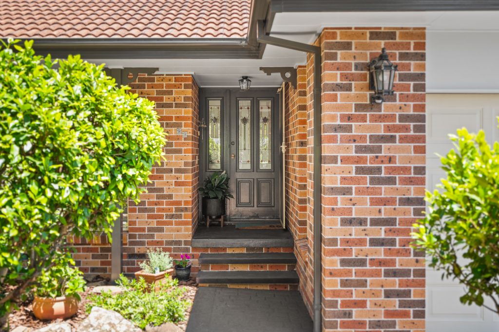 Brick front entrance and portico of a home in Erina NSW