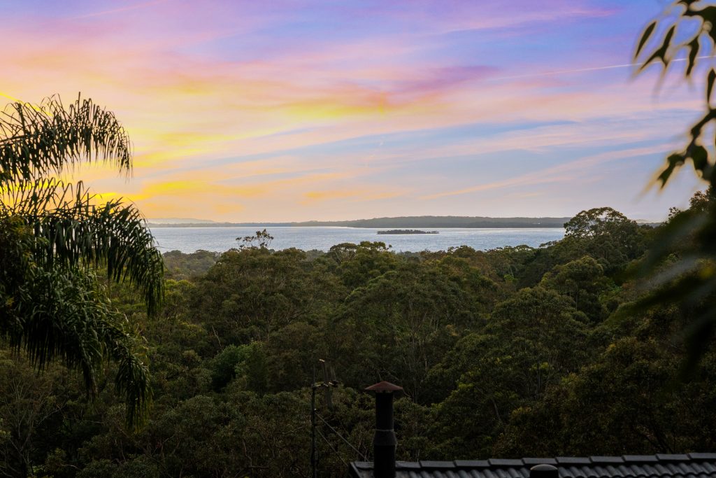 Sunset view over bushland to Tuggerah Lake from an elevated Tumbi Umbi property