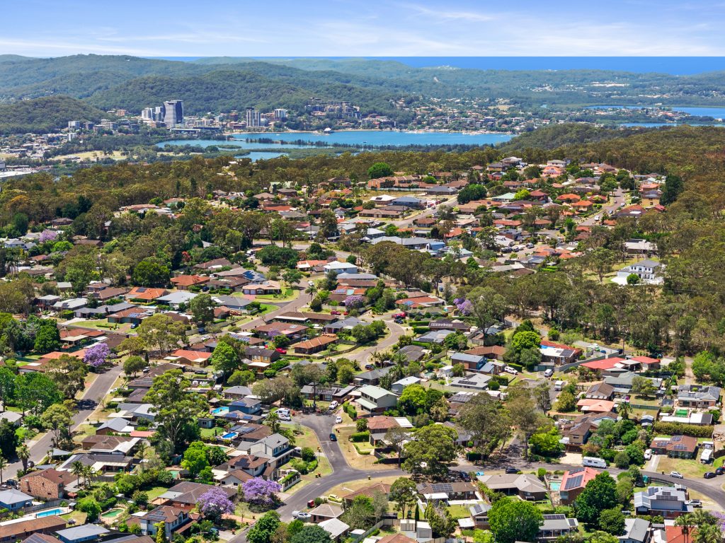 Aerial view over Kariong NSW looking east across the suburb to Brisbane Water and the Gosford CBD