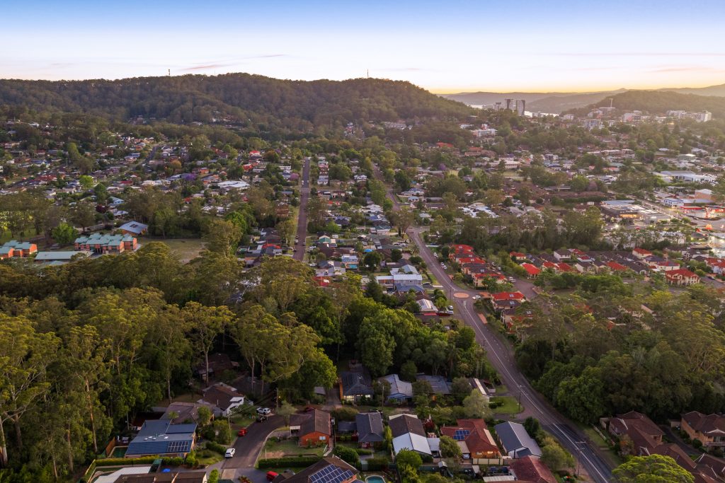Aerial view over Wyoming NSW at dusk, looking south towards Gosford and Brisbane Water
