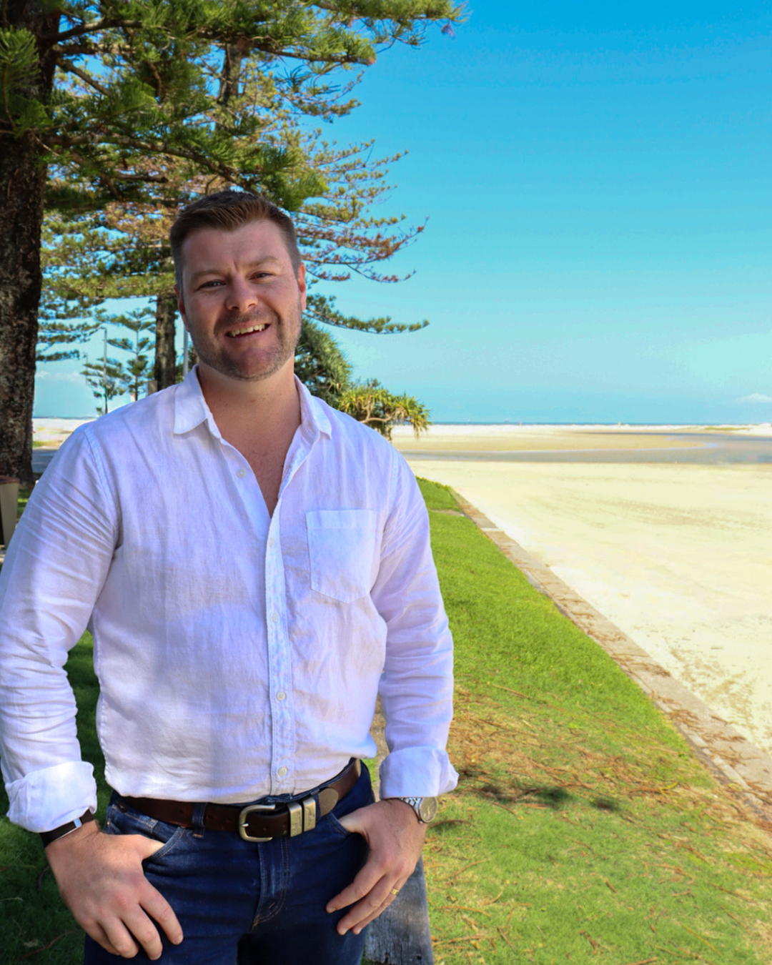 Grant standing by the beach