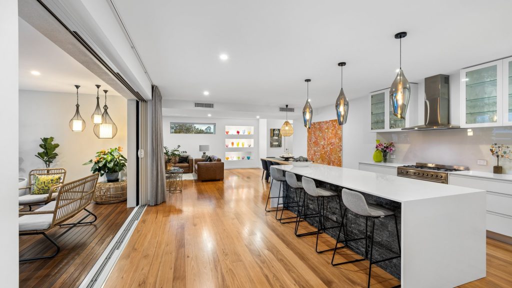 Open-plan living and kitchen in a Noosa North Rise home sold by imsold property. Caption: The consistency of quality inside the estate — imsold sale, Noosa North Rise